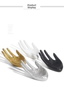 Detailed relief hand-shaped jewelry display stands in gold, silver, black, and white colors