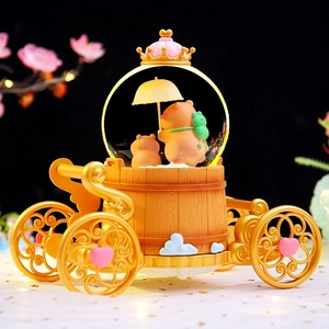Golden pumpkin carriage crystal ball featuring cute capybara and glowing lights