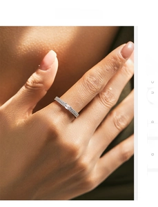 Detail of s925 silver double-row pave ring with marquise-cut zircon worn on finger