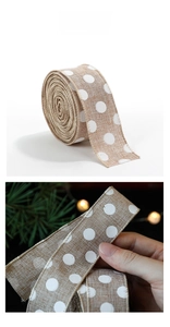Detailed view of burlap ribbon with white polka dots for rustic Christmas gift wrapping