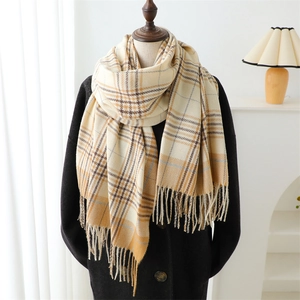 Classic plaid tassel scarf in beige and brown cashmere blend on a black wool coat