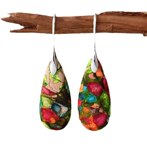 Bohemian imperial stone teardrop earrings on natural wood branch, colorful jewelry art