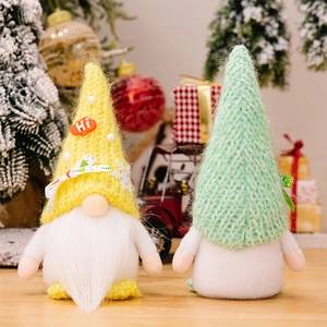 Detailed view of handmade Christmas gnomes with knit hats, snowflakes, and Hi signs