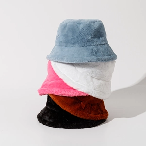 Five colorful plush bucket hats in soft faux fur stacked vertically on a light background