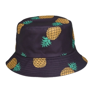 Navy blue bucket hat with yellow pineapple prints for sun protection at the beach