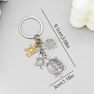 Antique silver and gold turtle alloy keychain with four sea turtle charms 9.1cm long