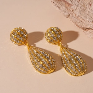 Elegant gold drop earrings with sparkling rhinestones in a vintage geometric metal design