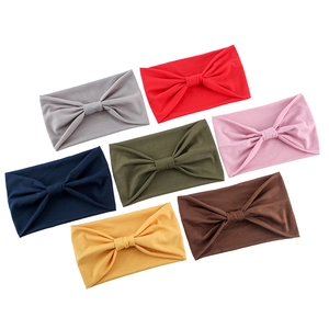 Elastic yoga headbands in 7 colors featuring a twisted knot design on white background
