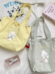 Minimalist canvas tote bag with cute sheep embroidery and drawstring closure in two colors