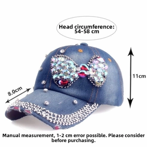 Close-up of denim baseball cap featuring rhinestone bow detail and 54-58cm sizing