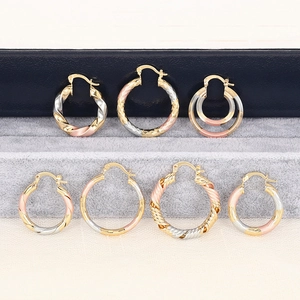 Detailed set of seven multi-tone hoop earrings with twisted and textured metal finishes