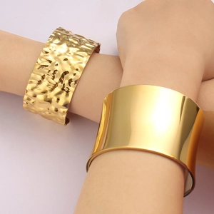 18K gold-plated titanium steel wide cuffs in hammered and smooth polished finishes