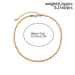 Detail view of gold layered chain with matte square beads and 40cm adjustable clasp