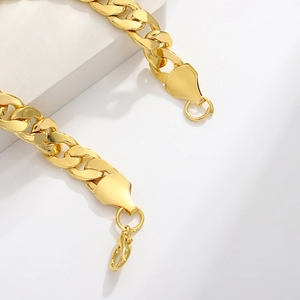 Polished gold cuban link chain bracelet with lobster clasp on minimalist base