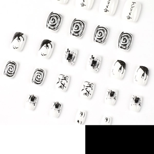 Gothic black and white press-on nails with manga style swirl and anime art patterns