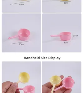 Handheld size comparison of miniature dollhouse plastic water ladles in pink and yellow