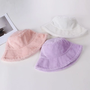 Detailed display of warm faux fur bucket hats in white, pink, and purple soft colors