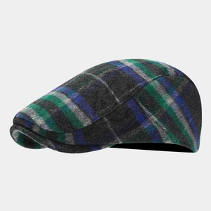 Detail of multi-color plaid newsboy cap with textured wool fabric and fine stitching