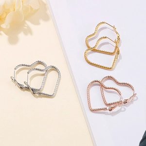 Minimalist heart-shaped hoop earrings with rope texture in gold, silver, and rose gold