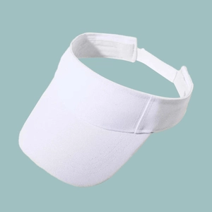 Close-up of a white breathable wide-brim visor sun hat for tennis and outdoor sports