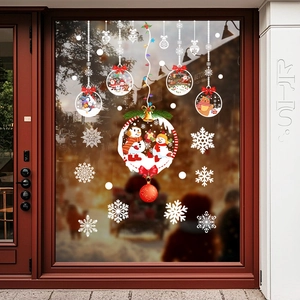 Christmas window decals with snowman and snowflakes on glass shop door for festive decoration