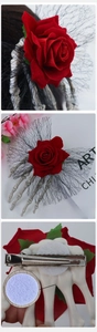 Detail of Gothic Halloween hair clip with red rose, skull hand, and stainless steel duckbill clip