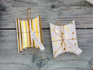 Gold striped and polka dot pillow candy boxes with Thank You tags for wedding favors