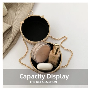 Detail view showing the interior capacity of this round gold woven evening clutch bag