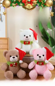 Detailed view of three plush Christmas teddy bears in a basket with festive hats