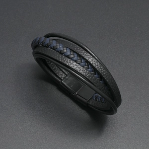 Close-up of multi-layer woven leather bracelet in black and blue with magnetic clasp