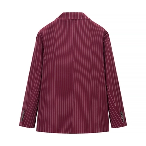 Macro detail of wine red striped blazer back showing buttons and tailored fabric texture