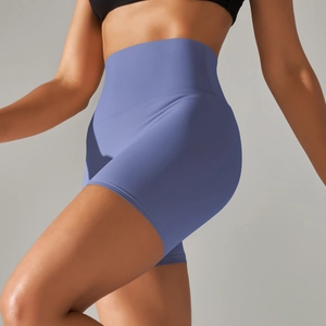 Detailed side view of high-waisted seamless fitness shorts showing stretch fabric and fit