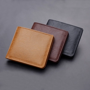 Classic men's leather bifold wallet in yellow, brown, and black with pebble texture
