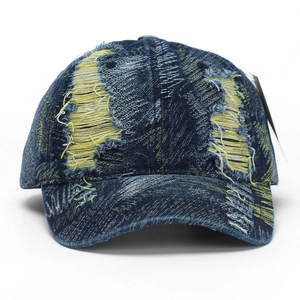 Distressed navy blue denim baseball cap with vintage frayed edges and yellow accents