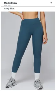 Detail view of high-waist navy blue yoga leggings with side pockets and slim fit design