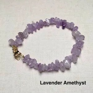 Detailed view of natural lavender amethyst chip stone bracelet with golden lobster clasp