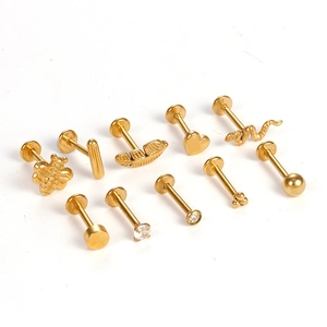 Set of 10 gold stainless steel lip studs featuring bee, heart, and zircon designs
