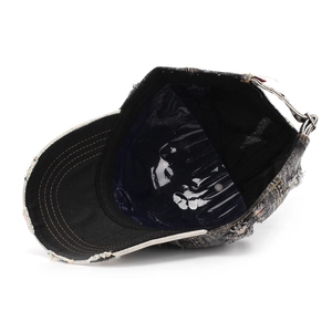 Adjustable metal buckle and distressed denim texture on the back of a vintage baseball cap