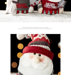 Close-up of plush Christmas Santa doll featuring knit textures and festive snow scene