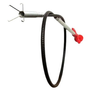 Flexible black plumbing snake with red handle and four-claw metal gripper for drain cleaning