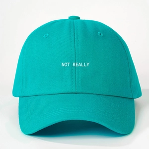 Adjustable teal cotton baseball cap with white Not Really embroidered text on front