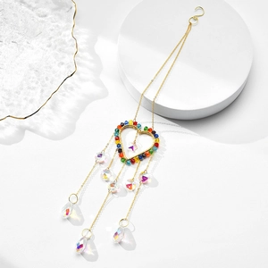 Rainbow crystal suncatcher with gold heart frame and teardrop prisms for window decor