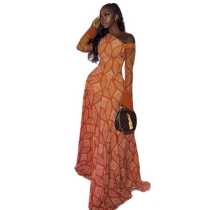 One-shoulder long sleeve dress in orange-brown geometric print with slim fit silhouette