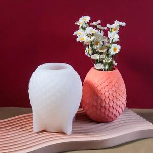 3D scale textured silicone mold with a coral pink finished vase and white daisies