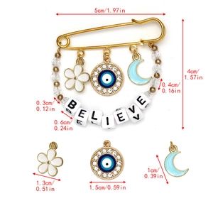 Detailed view of evil eye brooch with charms and BELIEVE letter beads showing dimensions