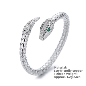 Macro detail of silver snake ring with green zircon eyes and 1.2g eco-copper band