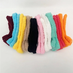 Detailed fan-shaped display of multi-color thick coral fleece winter socks in 10 vibrant tones