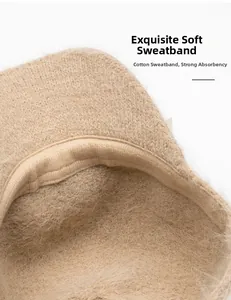 Close-up of soft beige knit baseball cap showing the cotton sweatband interior details