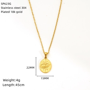 Macro view of 18K gold plated stainless steel necklace featuring sun eye oval pendant