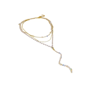 Fashionable layered gold Y-necklace with elegant pearls and sparkling rhinestones